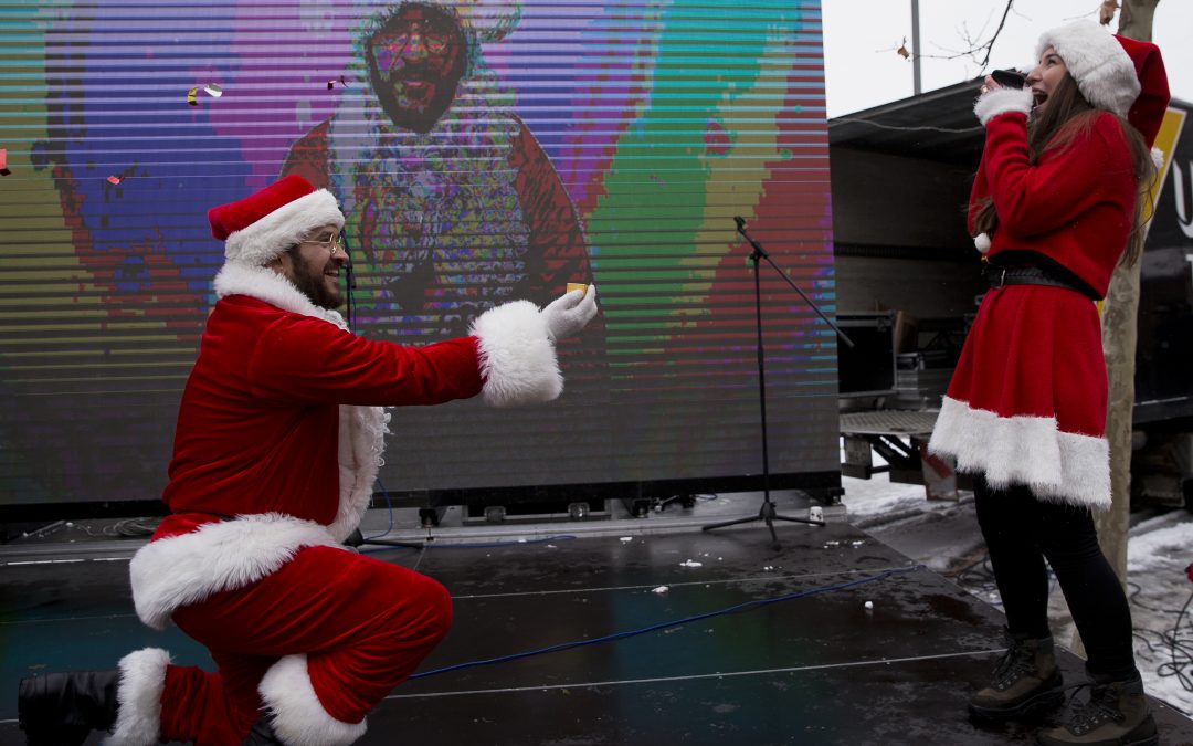 Albanian Santa proposes his partner dressed also as a Santa